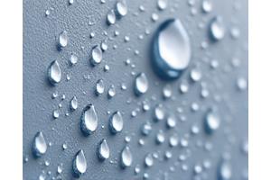 Exterior wall with tiny water beads on its surface, indicating effective sealing and weatherization